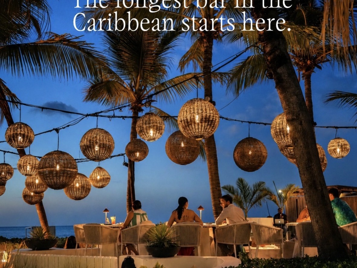 Infiniti Restaurant beachfront dining at dusk with woven lanterns